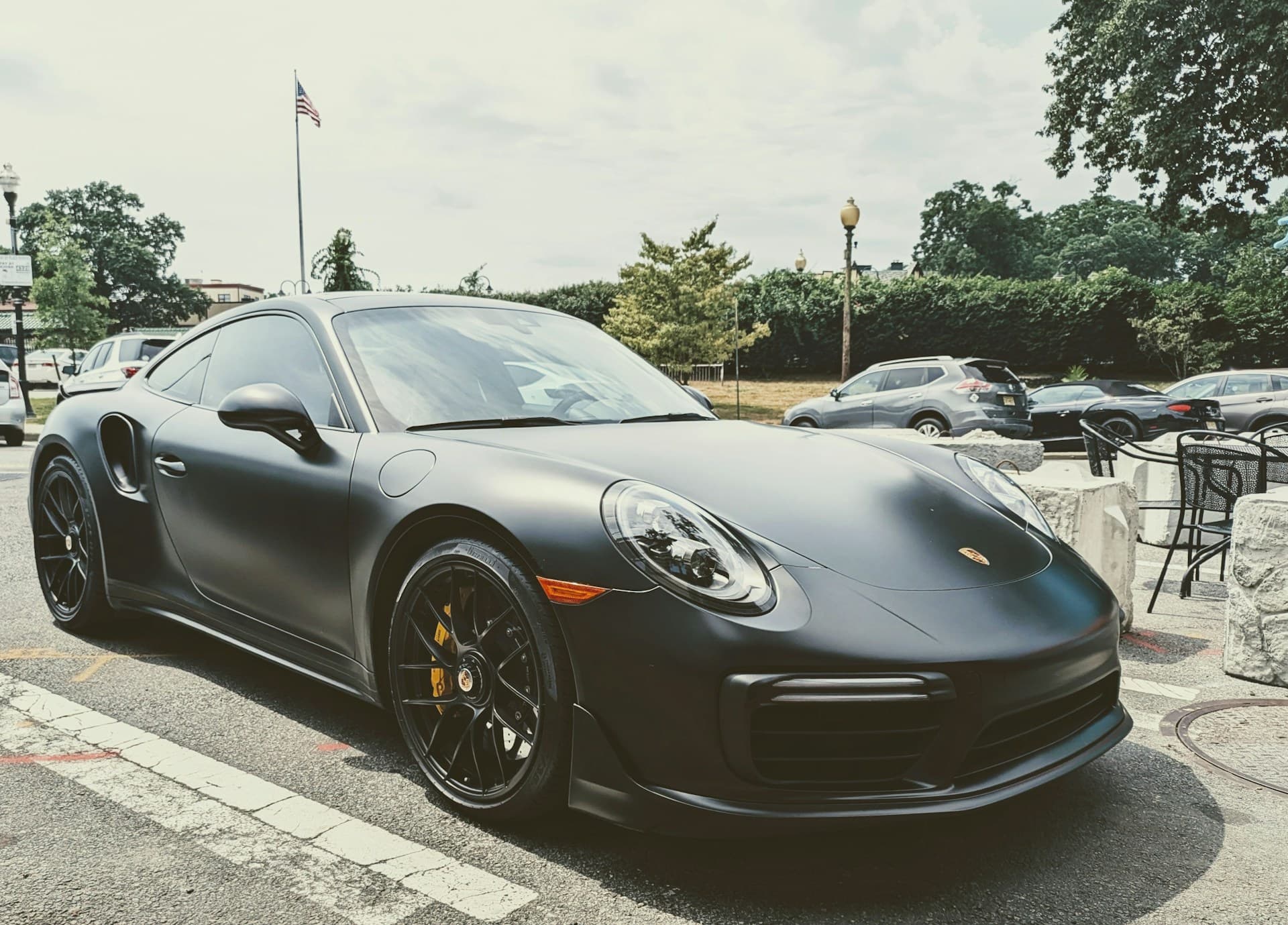 Matte black Porsche 911 Turbo S parked outdoors
