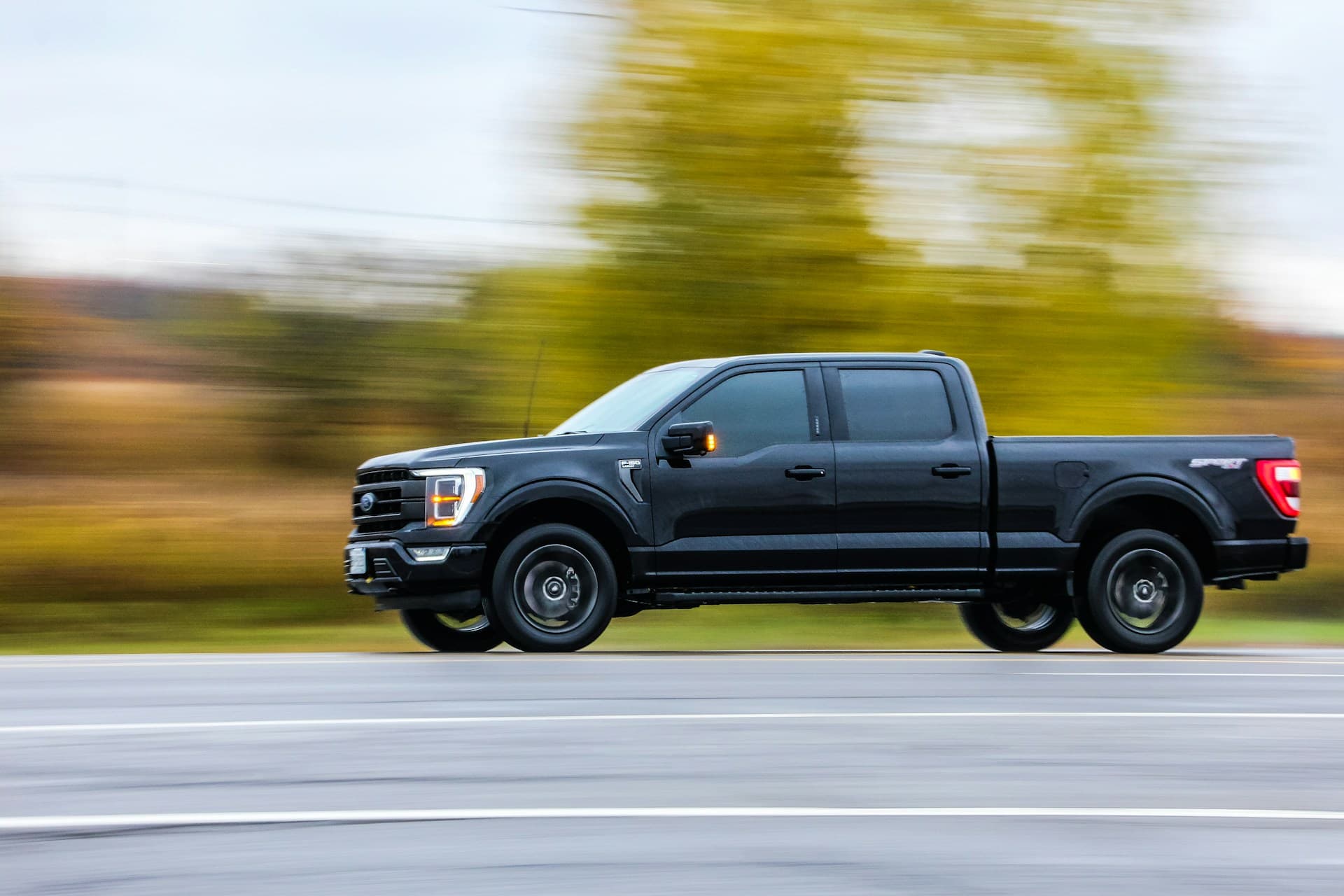 Blacked-out Ford F-150 crew cab on the move